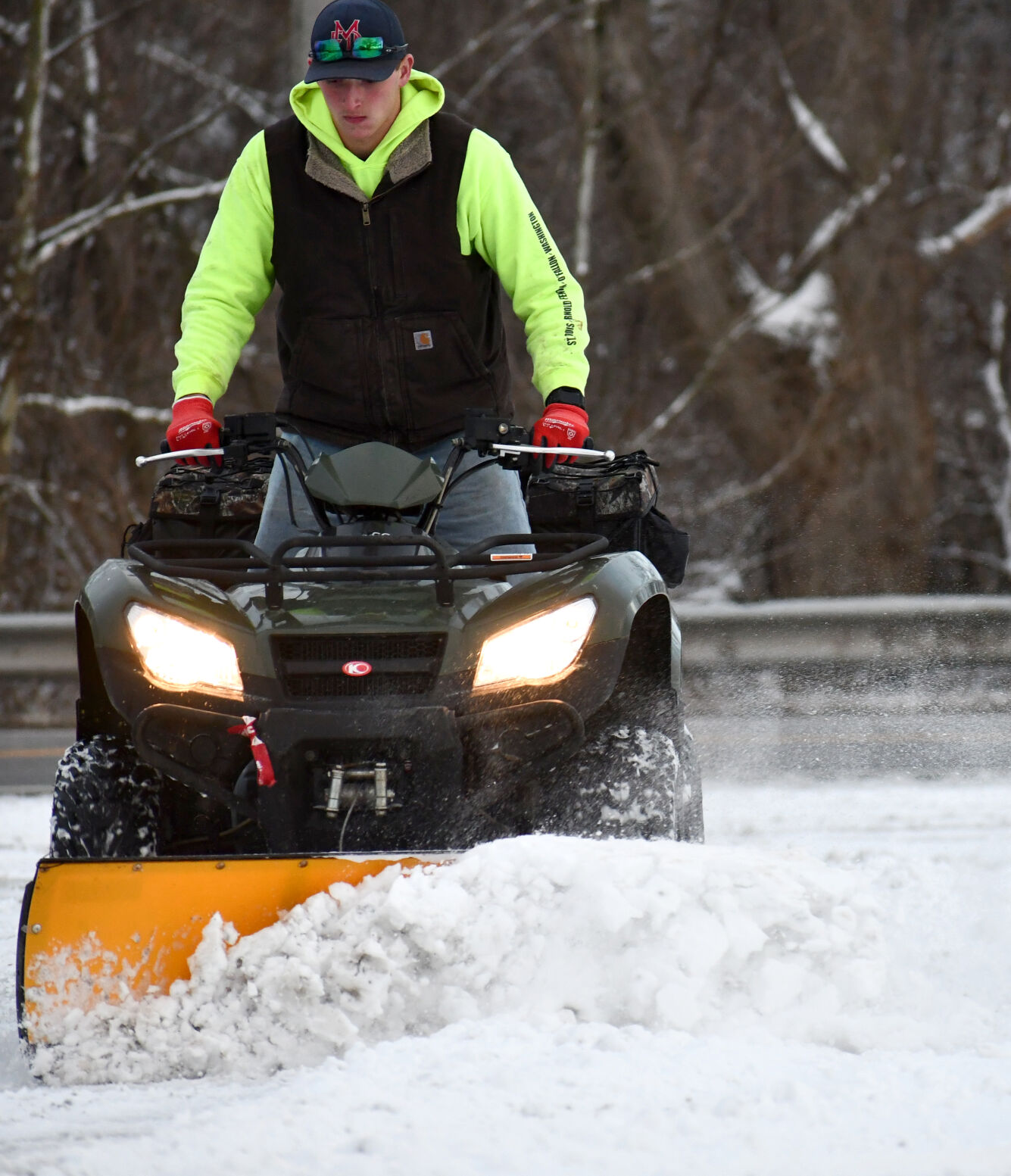 Sam Backhaus clears snow